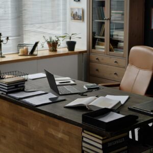 Wooden Desk with Laptop and Bible on Top