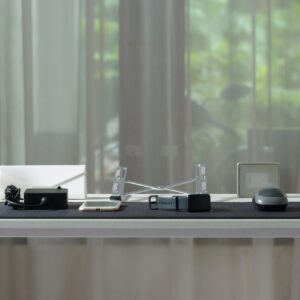 Clean and Minimalist Home Office Desk Setup Against a Window