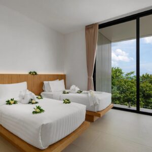 Modern twin bedroom with panoramic tropical view